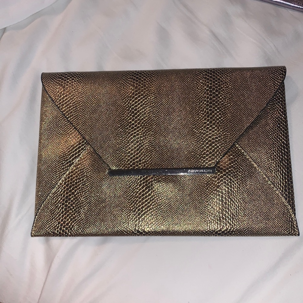 BCBG gold envelope clutch